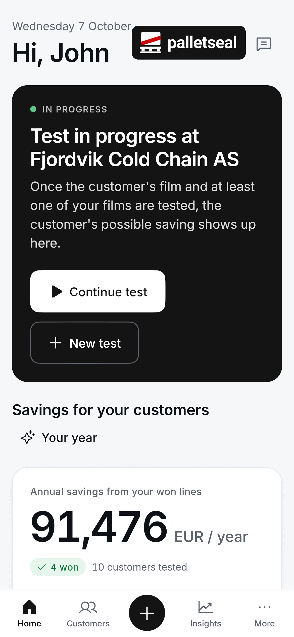 The same home screen on a phone: test in progress at a customer and annual savings from won lines. Fictional demo data.